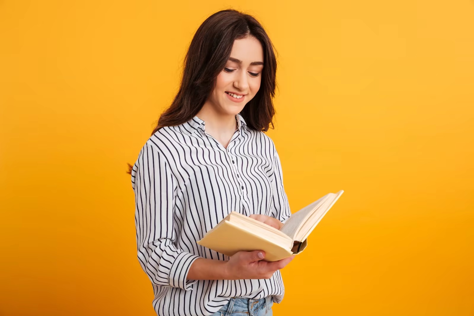  A lovely woman reading a book while glowing and feeling motivated